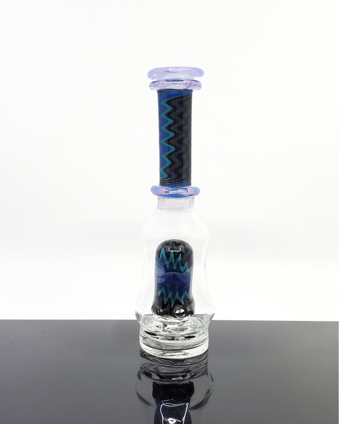 Logi Glass Art Wig Wag Puffco Attachment - Premium Handcrafted Design. Elevate your Puffco device with Logi Glass Art's Wig Wag attachment, featuring a unique 3-hole percolator for smooth draws. Available in Titan, Ghost, and Red Elvis styles, this piece combines artistry and function in each handcrafted detail.