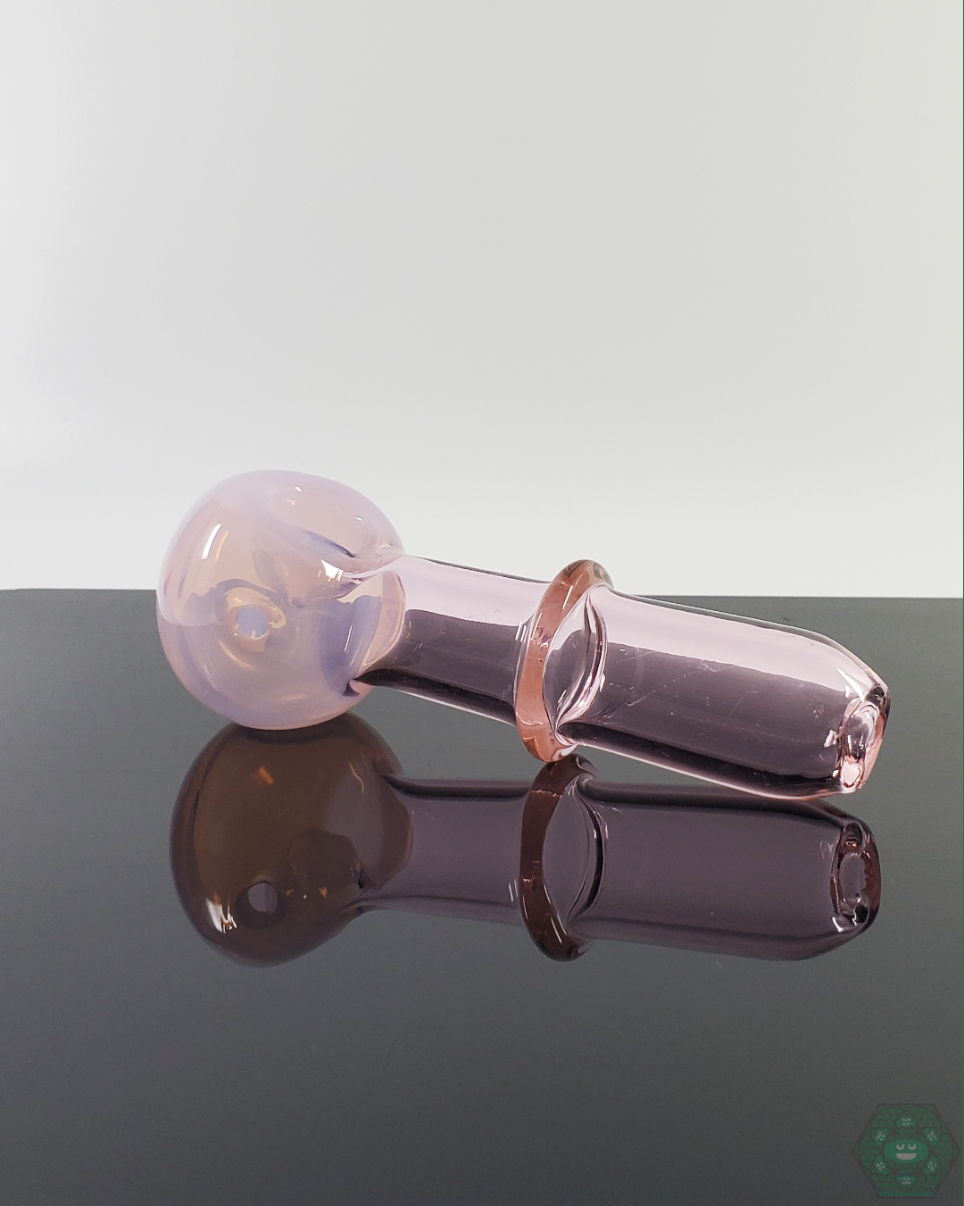 Pink Slyme Glass Spoon Pipe by American Spoon. This stylish pink glass spoon pipe offers smooth airflow and is crafted with thick, durable glass.