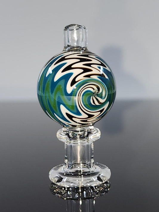 Close-up of the BSG Clear Wig-Wag Reversal Bubble Cap, highlighting its intricate wig-wag design and durable construction for optimal airflow and vapor production.