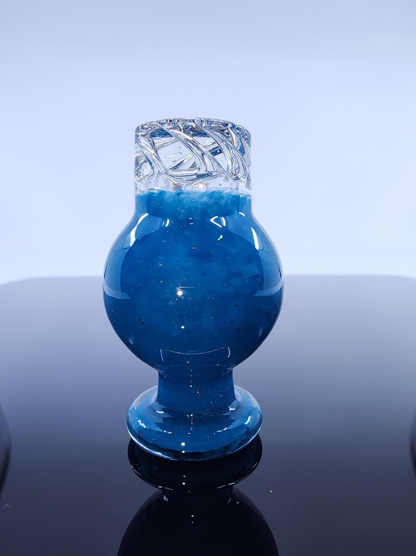BSG Dot Turbo Spinner Cap displayed with other dabbing accessories, showcasing its unique design and ability to improve the quality of your sessions.