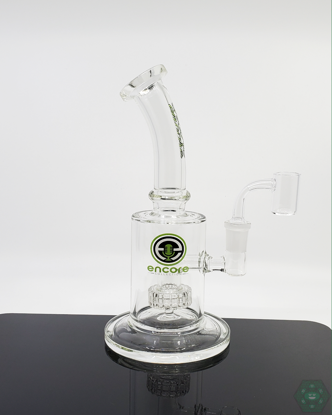 Encore Glass 9” Clear Matrix Rig in hand, demonstrating its compact and durable design for portable, easy use and enhanced filtration.
