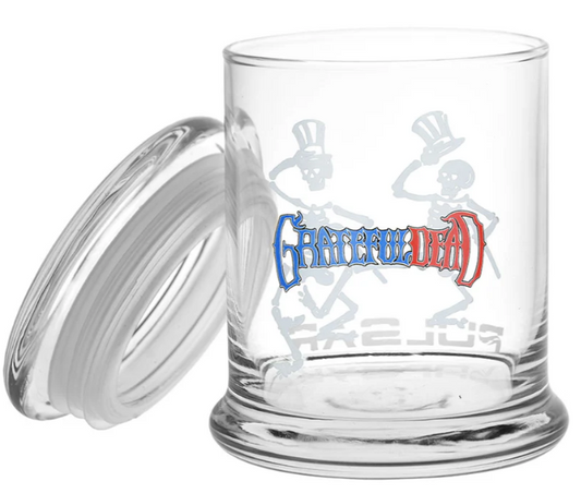 Grateful Dead x Pulsar Top Hat Skeletons Pop Top Jar – 1/2oz capacity glass stash jar with airtight seal and pop-top lid. Features permanent glass decals of dancing skeletons, perfect for preserving freshness.