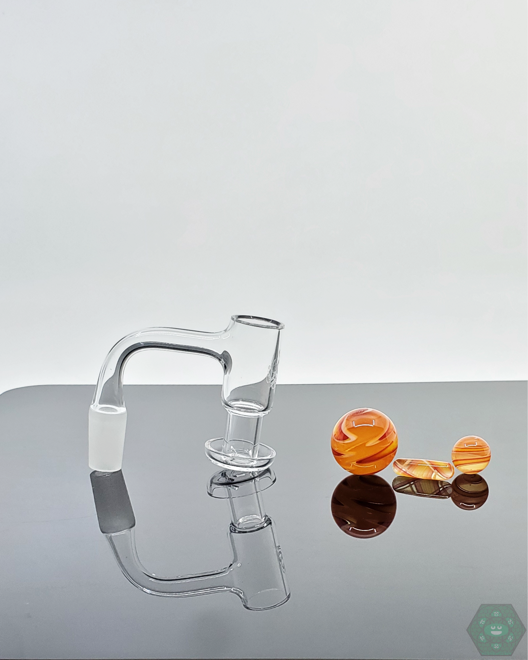 Nephilim Glass UV Linework Slurper Set highlighting the marble and terp pearls that glow under UV light for an enhanced dabbing experience.