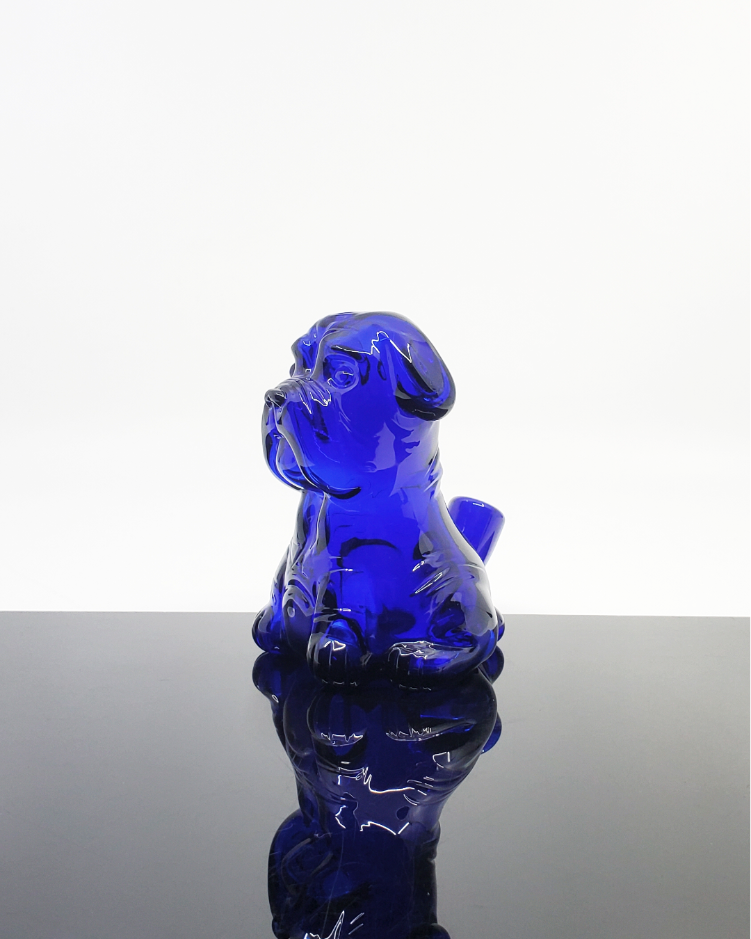 Angled view of the Swanny Glass Bulldog Rig, displaying its unique structure and durable glasswork for a standout piece.