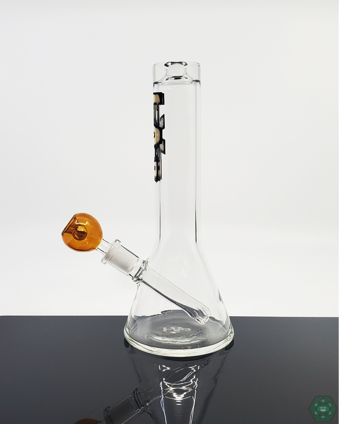Close-up of the TAG Glass Mini Beaker, highlighting its durable glass construction and efficient filtration for a smooth smoking experience.