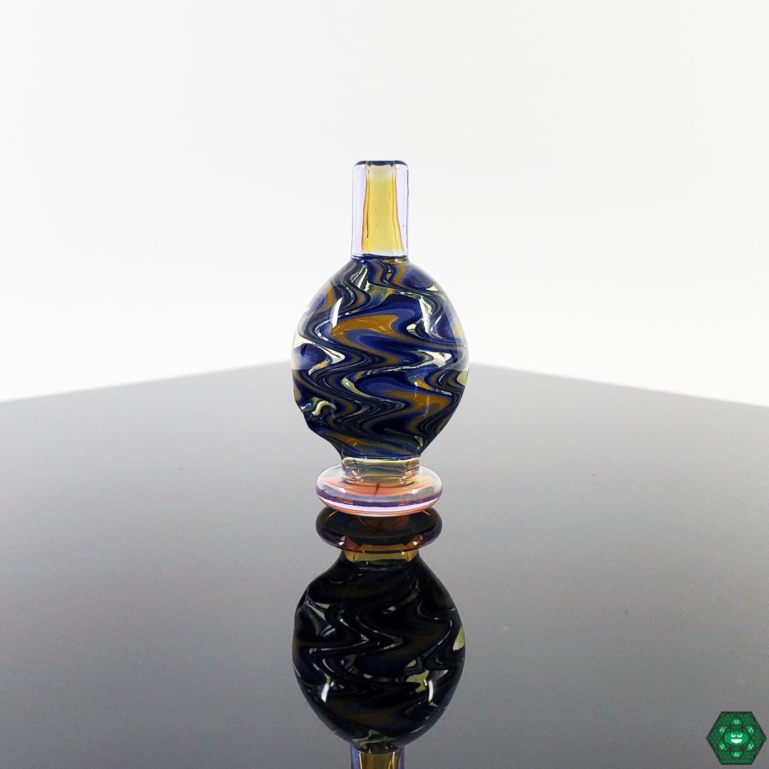 Bhomb Bhomb Glass Bubble Caps – Stylish Wig-Wag Design for Smooth Airflow. Color Options: Fume and Ether. Designed to fit 25MM quartz nails.