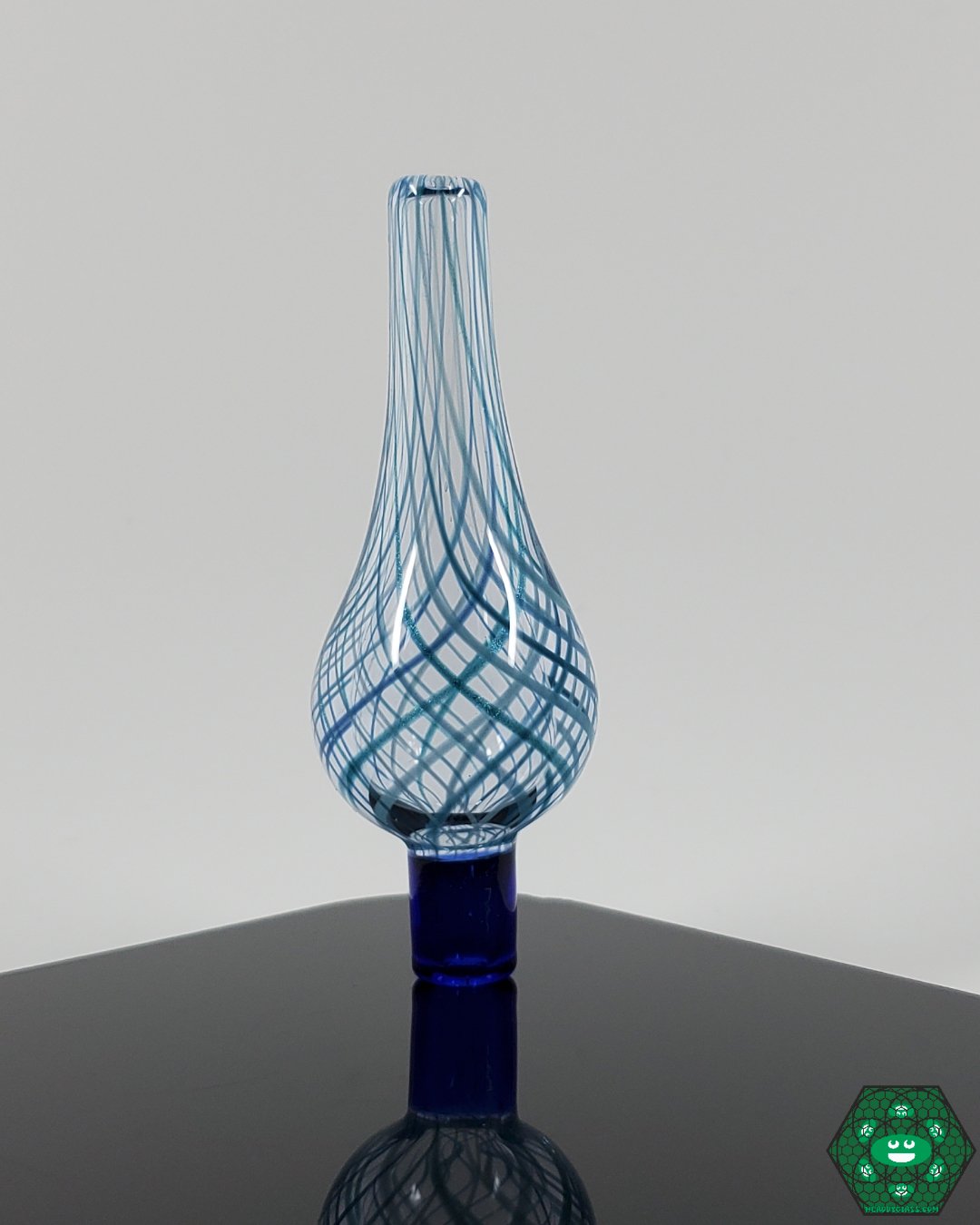 Blue Berry x Doq Tear Drop Bubble Cap - Enhanced Vapor Control. This tear-drop-shaped bubble cap offers optimal vapor flow and control, designed by Blue Berry x Doq. It combines functionality with striking style for any dab rig.