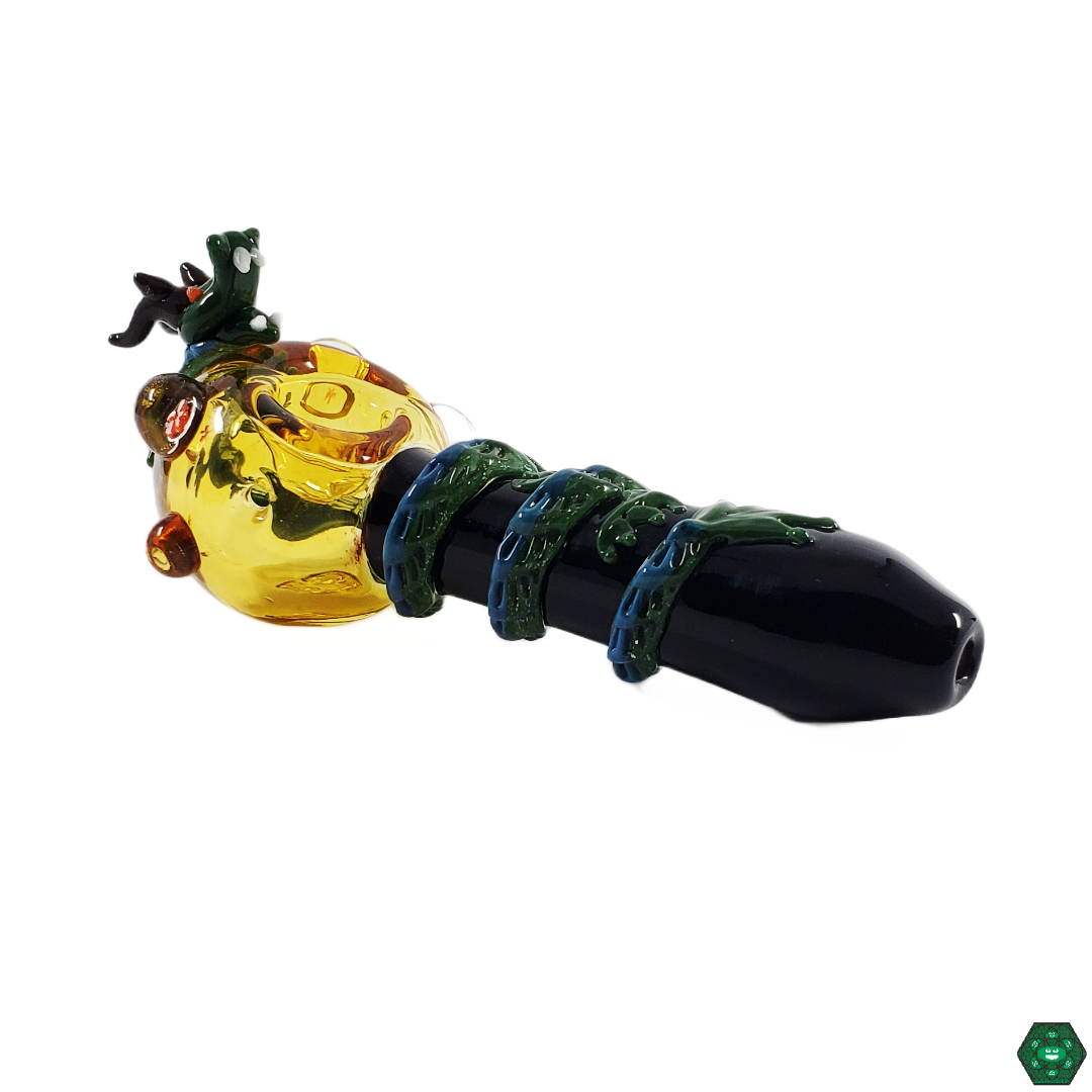 Empire Glassworks Dragon Sphere Spoon (Large) in hand, demonstrating its comfortable 5.75-inch size for both display and practical use.