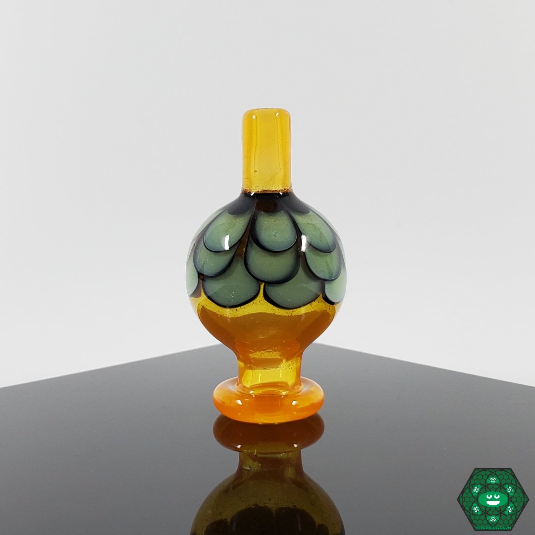 Night WLF Caps, a custom glass dab tool designed for smooth and efficient dabs with improved airflow control.