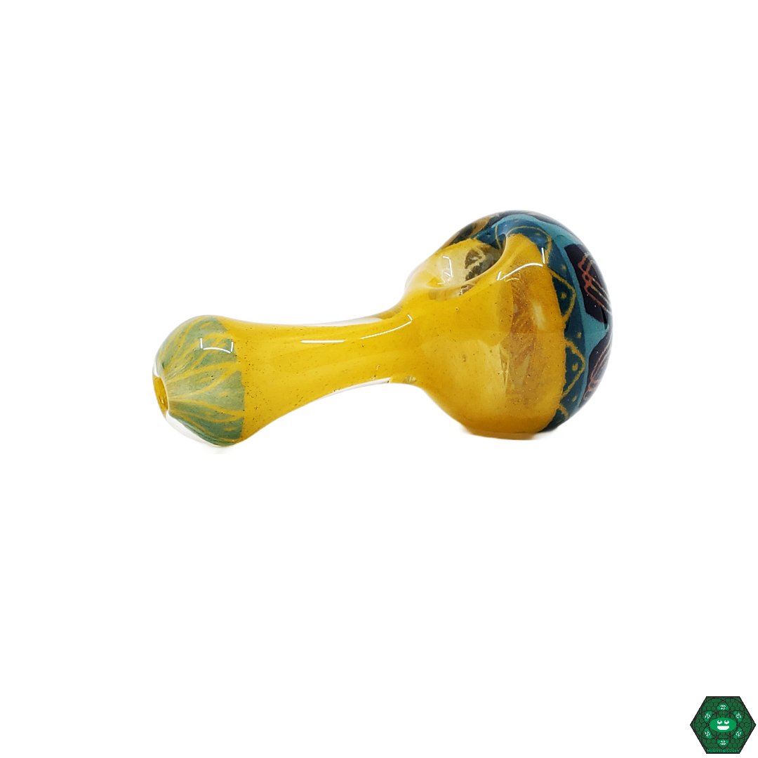 OM Glass Spoon Pipe, a custom artistic glass pipe featuring unique patterns and a high-quality glass build.
