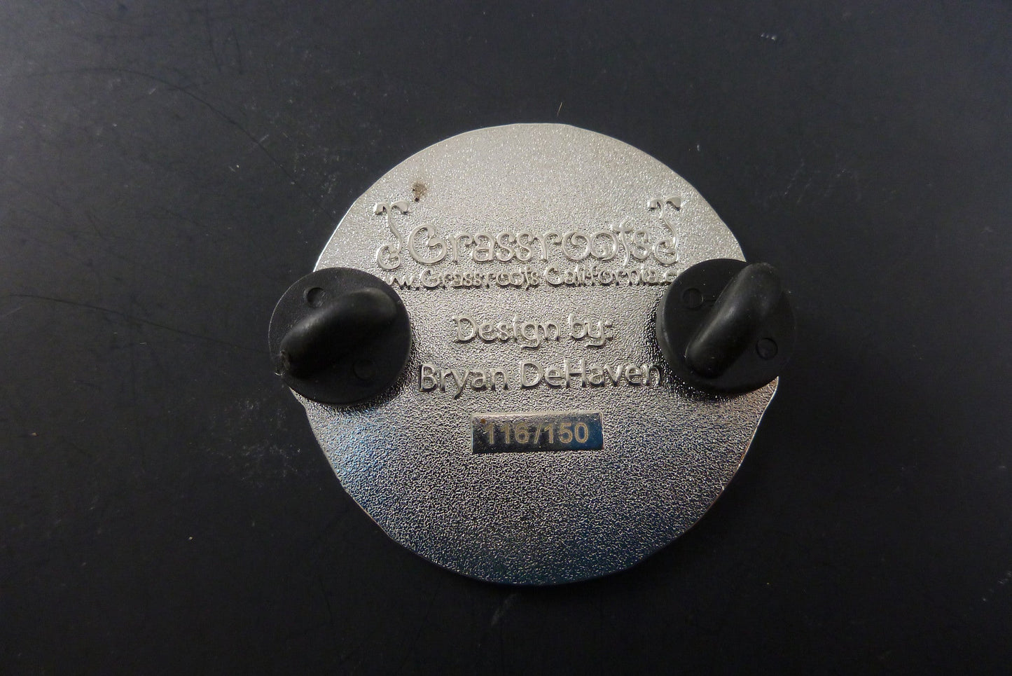 Close-up of the Sproutdoors Axe Pin, showcasing its detailed rugged design and high-quality metal finish, perfect for those who love outdoor adventures.