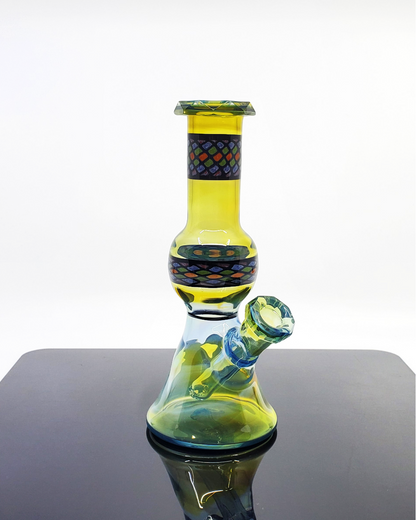 10mm Faceted Jammer Handcrafted Rig: The Shipley Glass Plantphibian Jammer is an artisan-crafted rig with a unique faceted design and sleek lines, providing smooth functionality and a modern aesthetic for any glass enthusiast.
