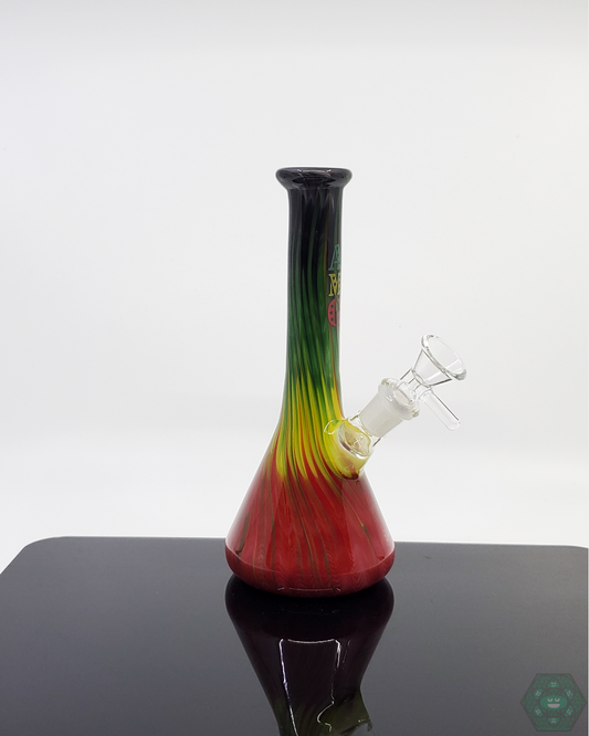 AMG Glass 7.75” Rasta Beaker | Durable with Rasta Accents | Smooth Filtration. This vibrant Rasta Beaker combines bold colors with a sturdy build. Enjoy smooth hits with this classic 7.75” beaker design.


