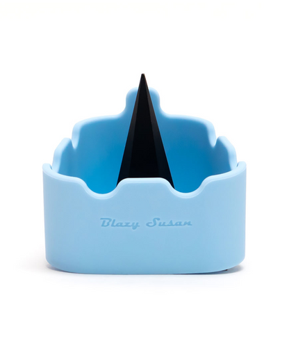 Blazy Susan - Premium Silicone Deluxe Ashtray + Debowler. This flexible, mess-free ashtray and bowl cleaner is perfect for ashing out clogged-up bowls. It features a built-in spike for extra clearing action and comes in an assortment of colors. It is dishwasher-friendly and color fade resistant.

