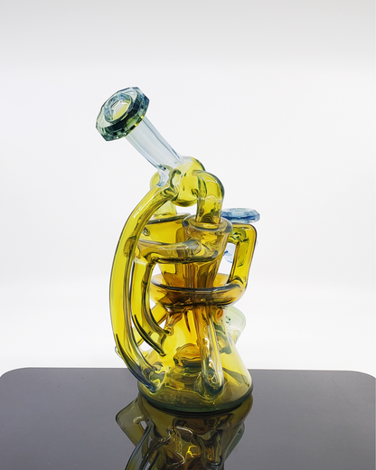 Discover the Bowman Glass V5 Dual Recycler: A Stunning Piece with 3-Hole Perc, Opal-Incased Gem, and Faceted Mouthpiece.