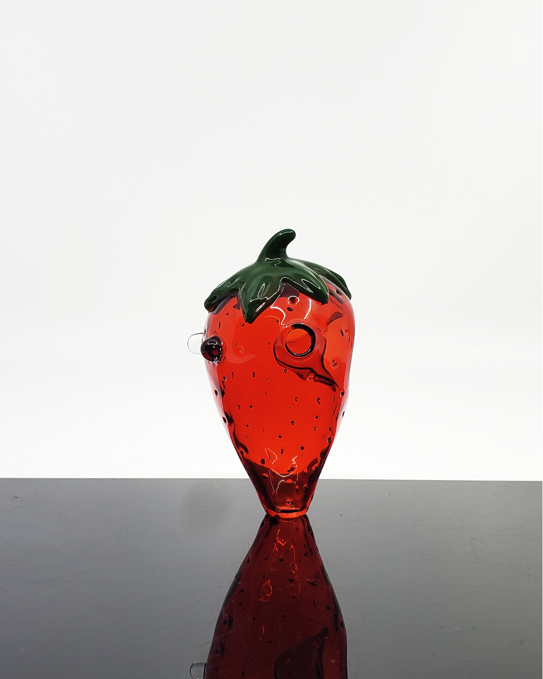 Glass by Boots - Strawberry Spoon – Unique Strawberry-Shaped Spoon Pipe. Creative Strawberry Design: Adds a unique, playful look. Quality Glass Construction: Durable and ideal for frequent use. Smooth Airflow: Designed for balanced hits with a comfortable grip.