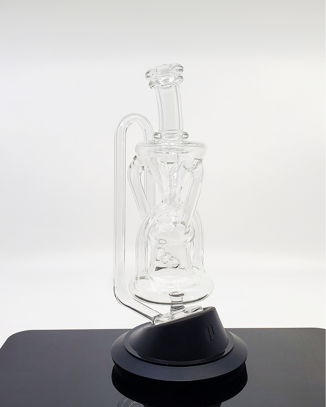  Logi Glass Art Recycler 3x2 Puffco Attachments - 8" Triple Uptake Water Pipe Accessory. Triple Uptake System for superior filtration. 4-Hole Perc provides smooth and clean hits. Dual Drain ensures efficient airflow and dabbing. Compact Design: 8" tall, 1.5" diameter for portability. Designed for Puffco Devices to enhance your setup.