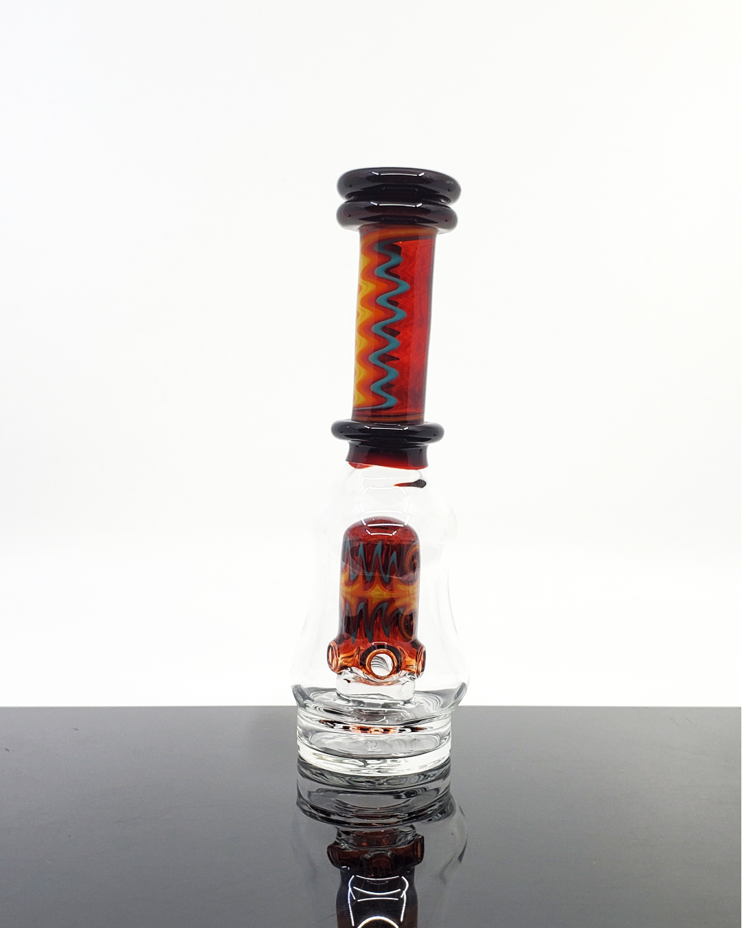 Logi Glass Art Wig Wag Puffco Attachment - Premium Handcrafted Design. Elevate your Puffco device with Logi Glass Art's Wig Wag attachment, featuring a unique 3-hole percolator for smooth draws. Available in Titan, Ghost, and Red Elvis styles, this piece combines artistry and function in each handcrafted detail.