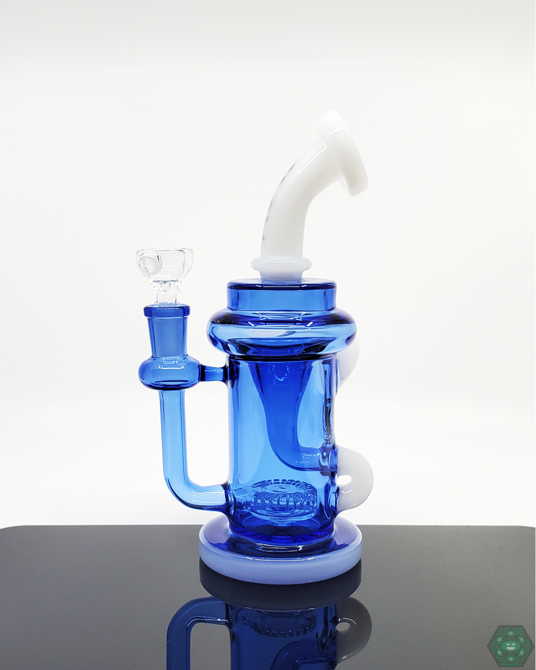 The Monterey Recycler by MAV Glass offers an advanced recycling function for smoother, cleaner hits. Its design enhances filtration and airflow for a quality experience.