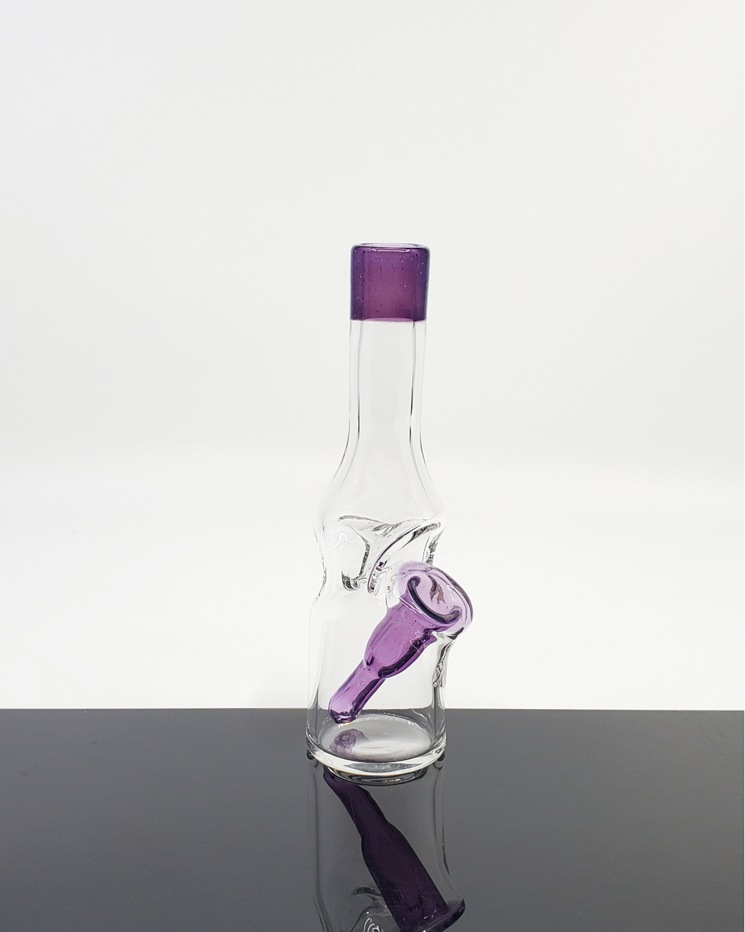 Bro D Glass Mini Bottle with color accents, a compact and portable dab rig designed for smooth performance.