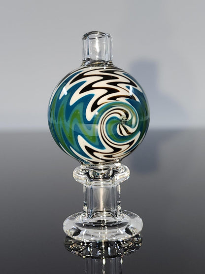  Close-up of the BSG Clear Wig-Wag Reversal Bubble Cap, highlighting its intricate wig-wag design and durable construction for optimal airflow and vapor production.