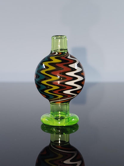 Close-up of the BSG Color Wig-Wag Reversal Bubble Cap, showcasing its intricate color wig-wag reversal design and durable construction for enhanced dabbing performance.