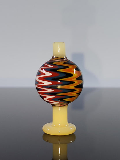 BSG Color Wig-Wag Reversal Bubble Cap in hand, demonstrating its easy-to-handle design and the smooth airflow it provides for enhanced dabbing experiences.