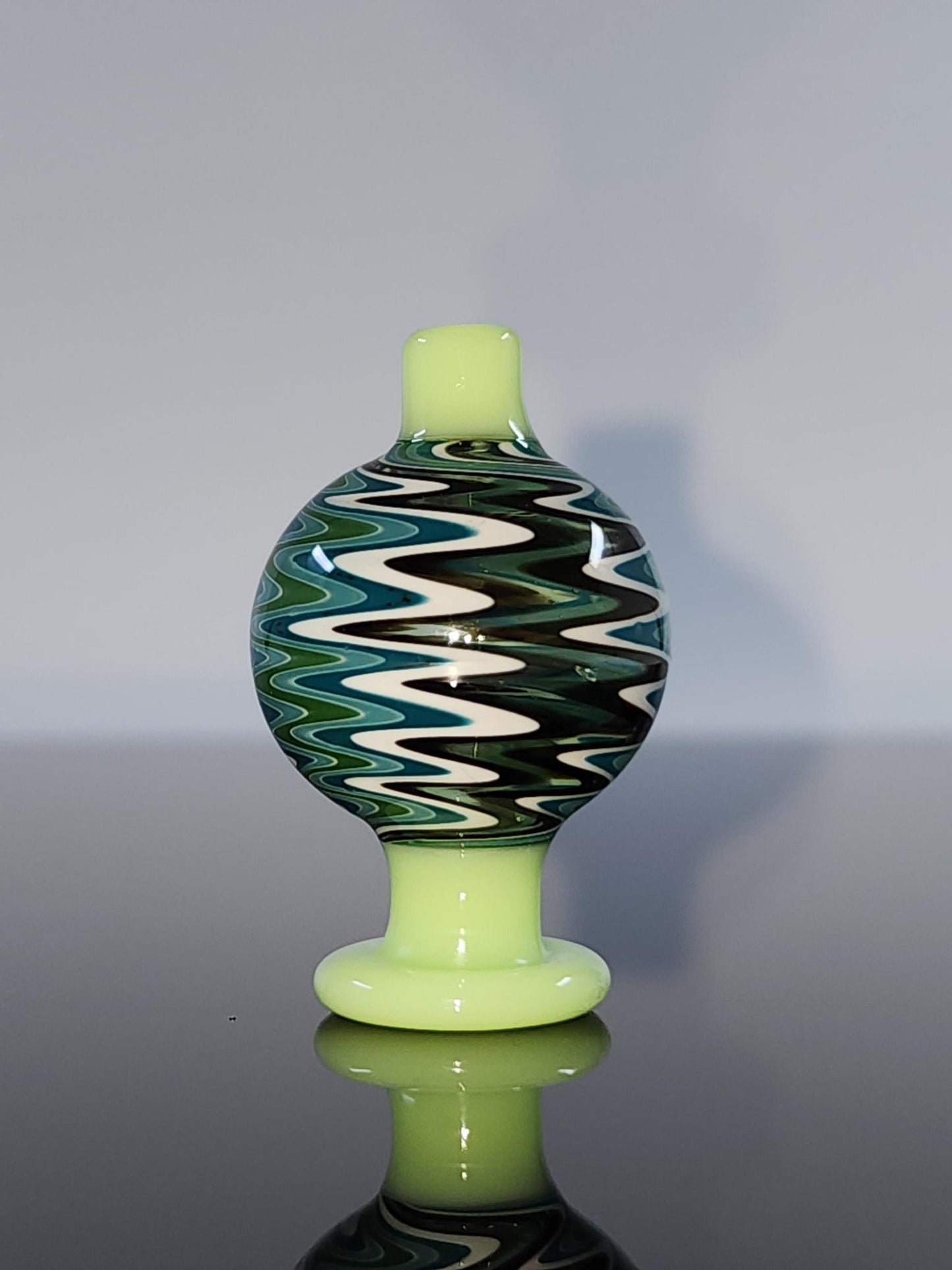  BSG Color Wig-Wag Reversal Bubble Cap placed on a 25mm quartz banger, optimizing vapor flow and ensuring a smoother, more flavorful dabbing experience.