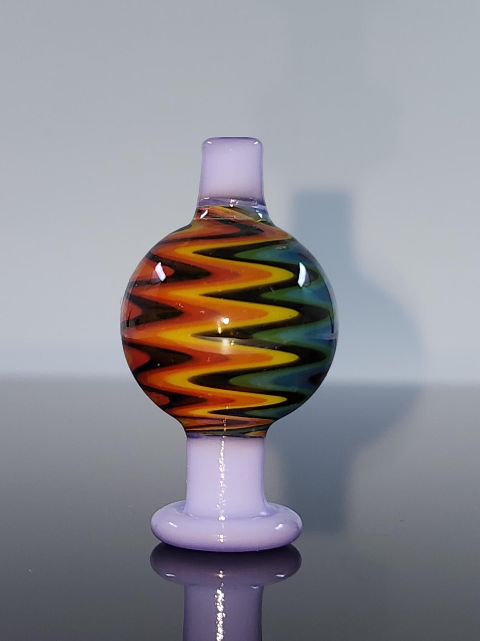  Side view of the BSG Color Wig-Wag Reversal Bubble Cap, highlighting its unique design and ergonomic shape for comfortable grip and easy handling during dabbing sessions.