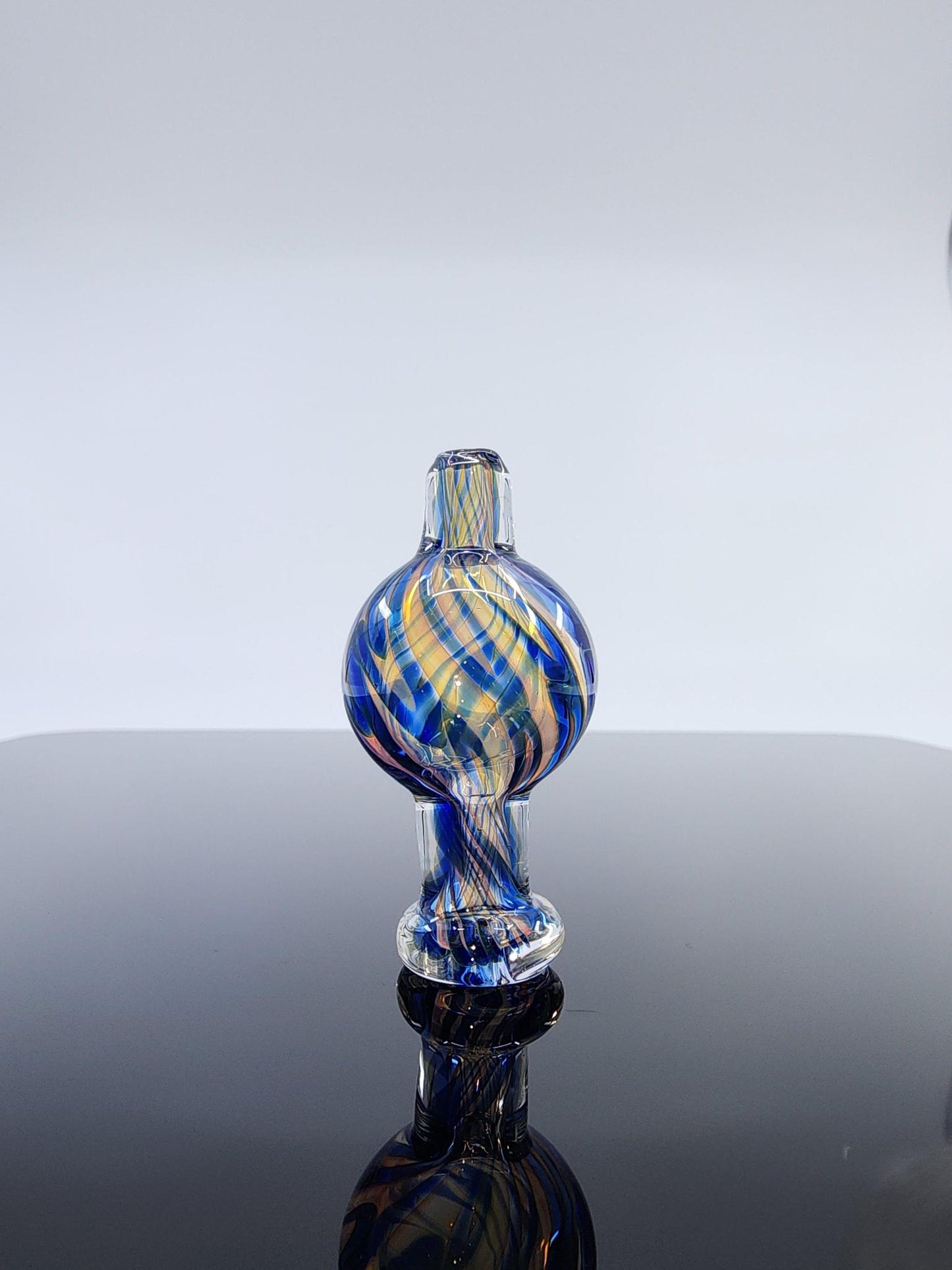  BSG Dichro Airflow Bubble Cap in hand, demonstrating its comfortable grip and ergonomic design for effortless use and efficient airflow during dabbing sessions.