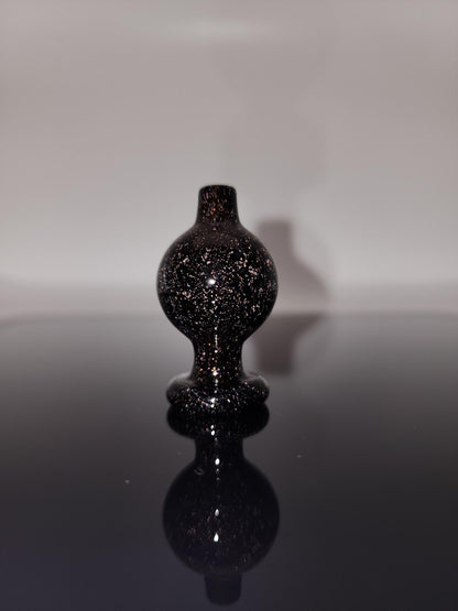 BSG Dichro Bubble Cap in hand, demonstrating its ergonomic design for a comfortable grip and easy handling during dabbing sessions.