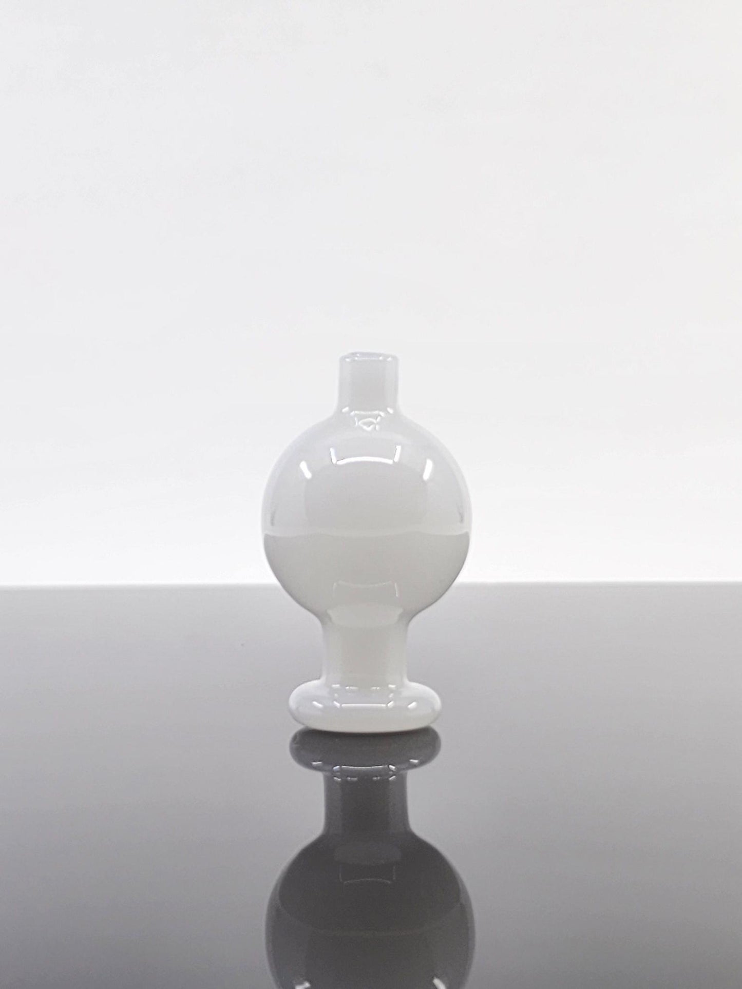 BSG Full Color Bubble Cap alongside other dabbing accessories, showing its unique design and compatibility with 25mm quartz buckets.