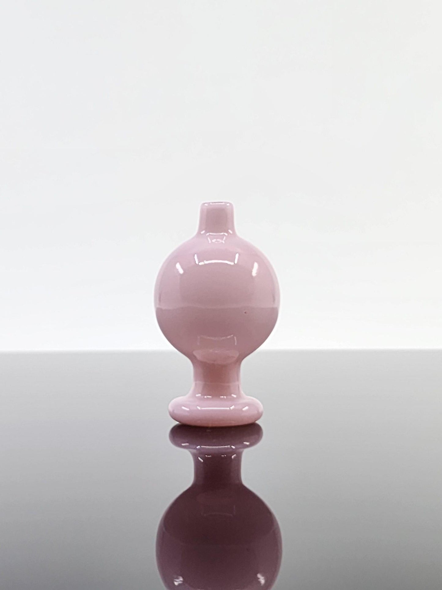  Side view of the BSG Full Color Bubble Cap, highlighting its vibrant color and smooth design for optimal airflow during dabbing.