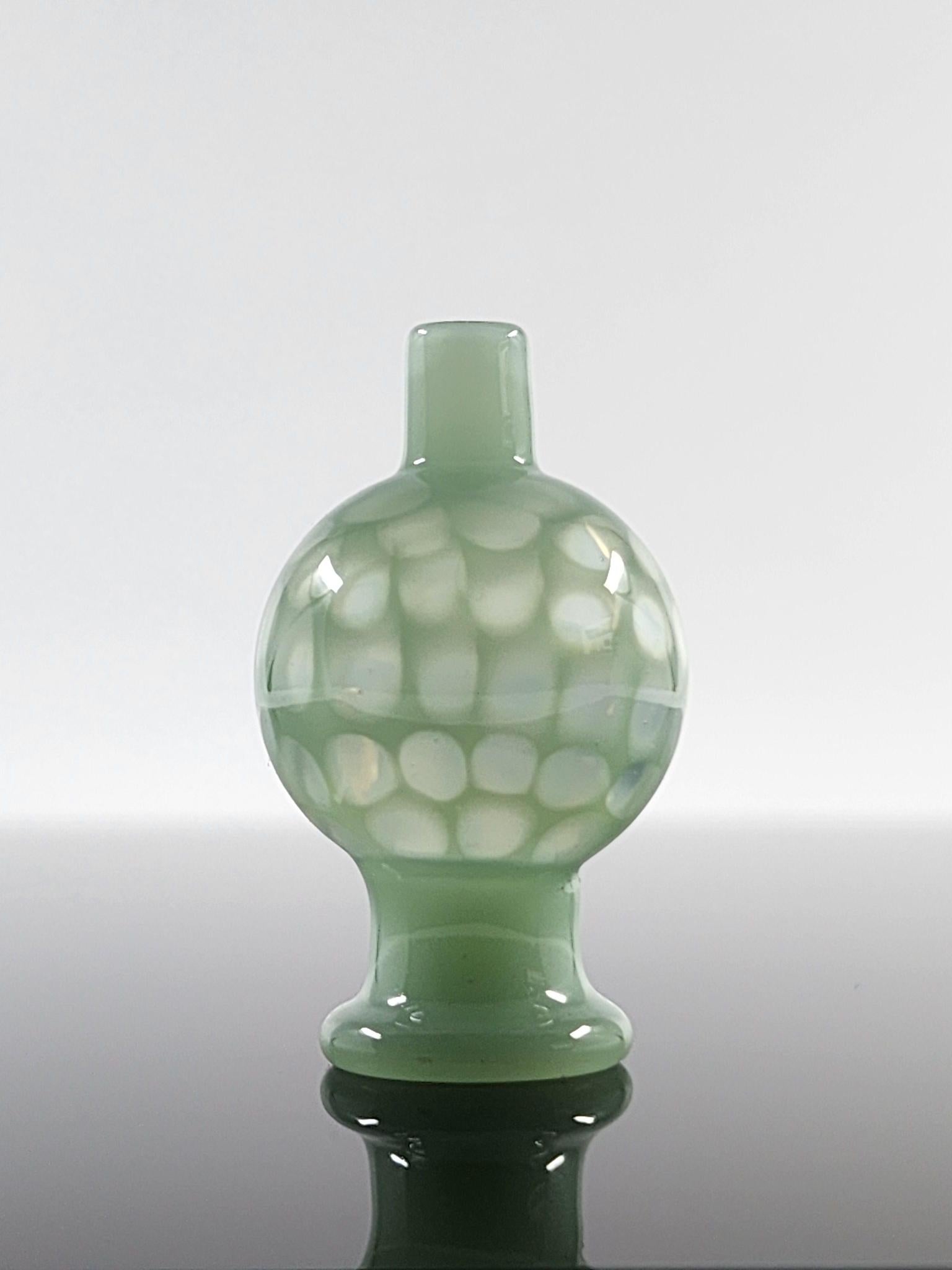  BSG Full Color Honeycomb Bubble Cap in hand, demonstrating its ergonomic design and comfortable grip for efficient airflow control during dabbing sessions.