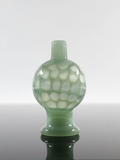  BSG Full Color Honeycomb Bubble Cap in hand, demonstrating its ergonomic design and comfortable grip for efficient airflow control during dabbing sessions.