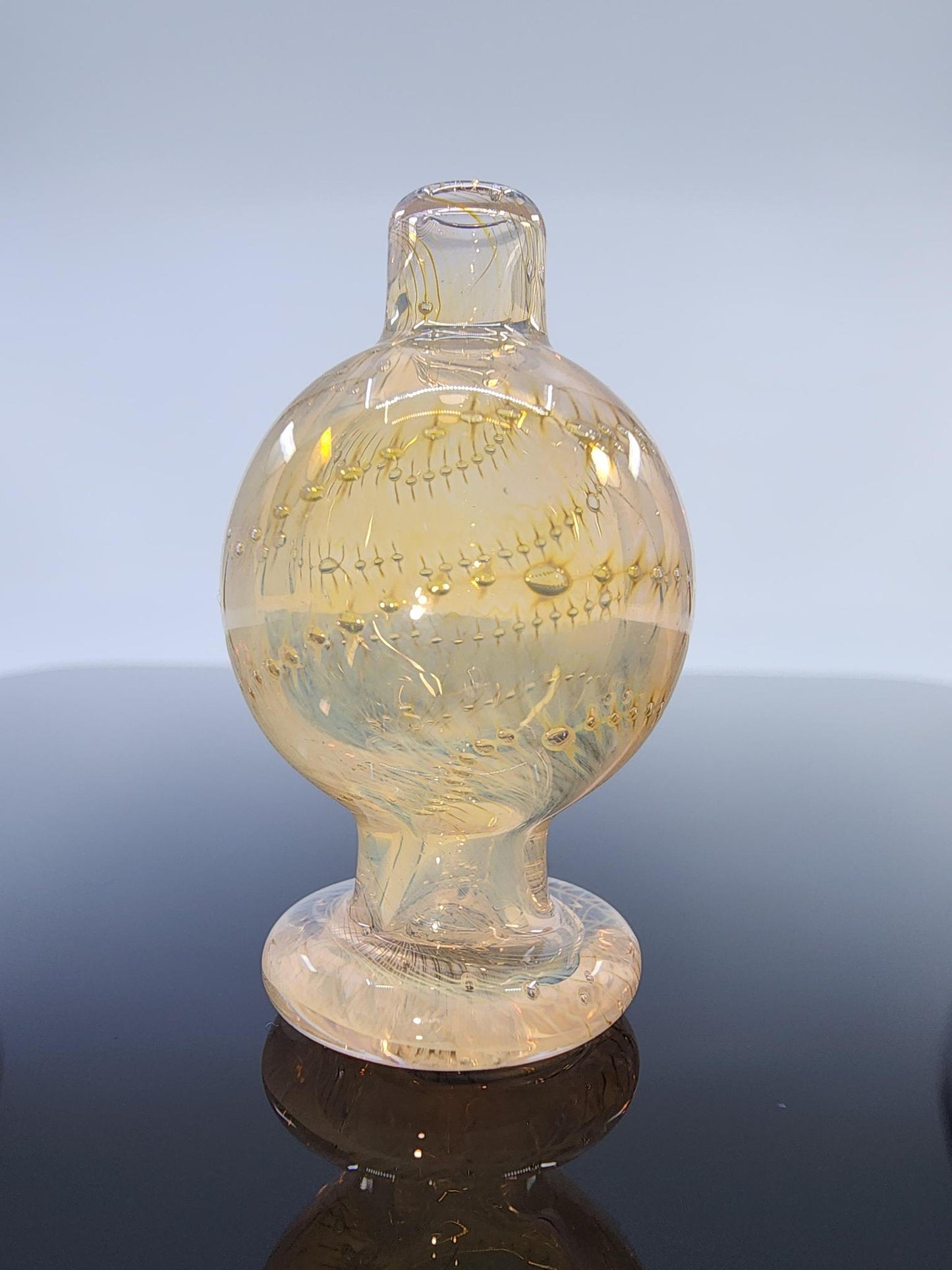 BSG Fume Air Trap Bubble Cap in hand, demonstrating its ergonomic design and comfortable grip for easy use during dabbing sessions.