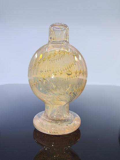 BSG Fume Air Trap Bubble Cap in hand, demonstrating its ergonomic design and comfortable grip for easy use during dabbing sessions.