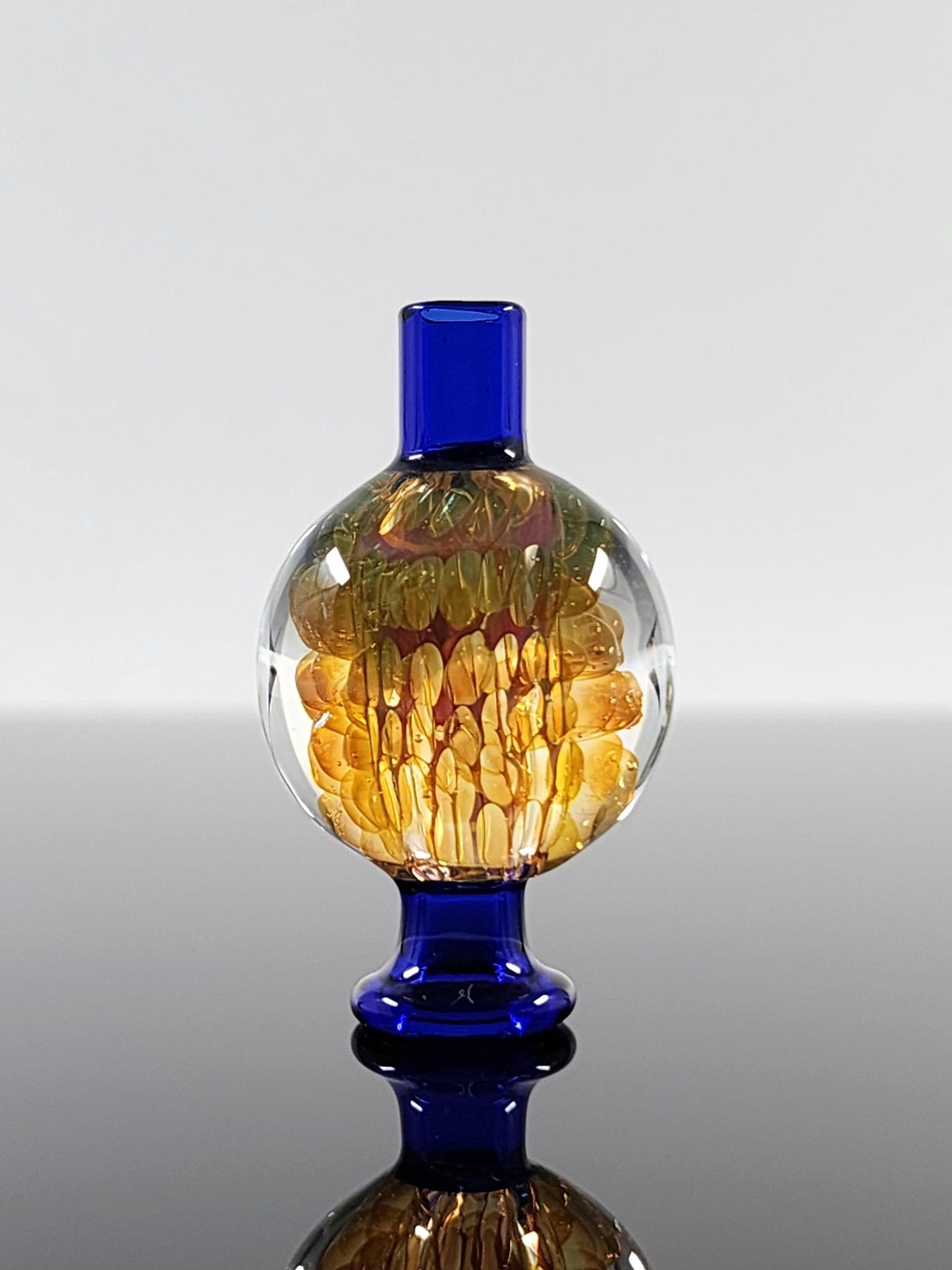 BSG Implosion Bubble Cap attached to a 25mm quartz banger, enhancing airflow and vapor flow for smoother, more flavorful dabs.