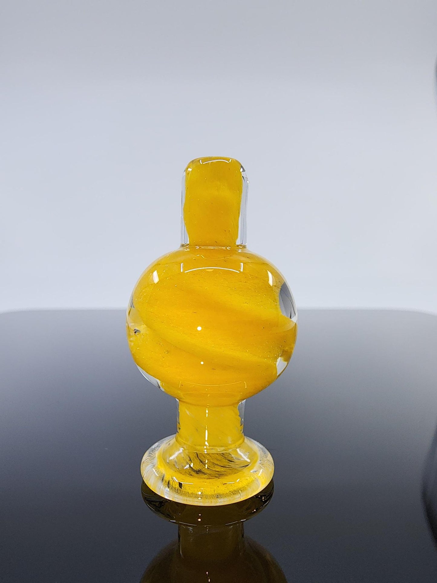  BSG Spiral Airflow Bubble Cap placed on a 25mm quartz banger, enhancing vapor control and airflow for a smoother and more flavorful dabbing experience.