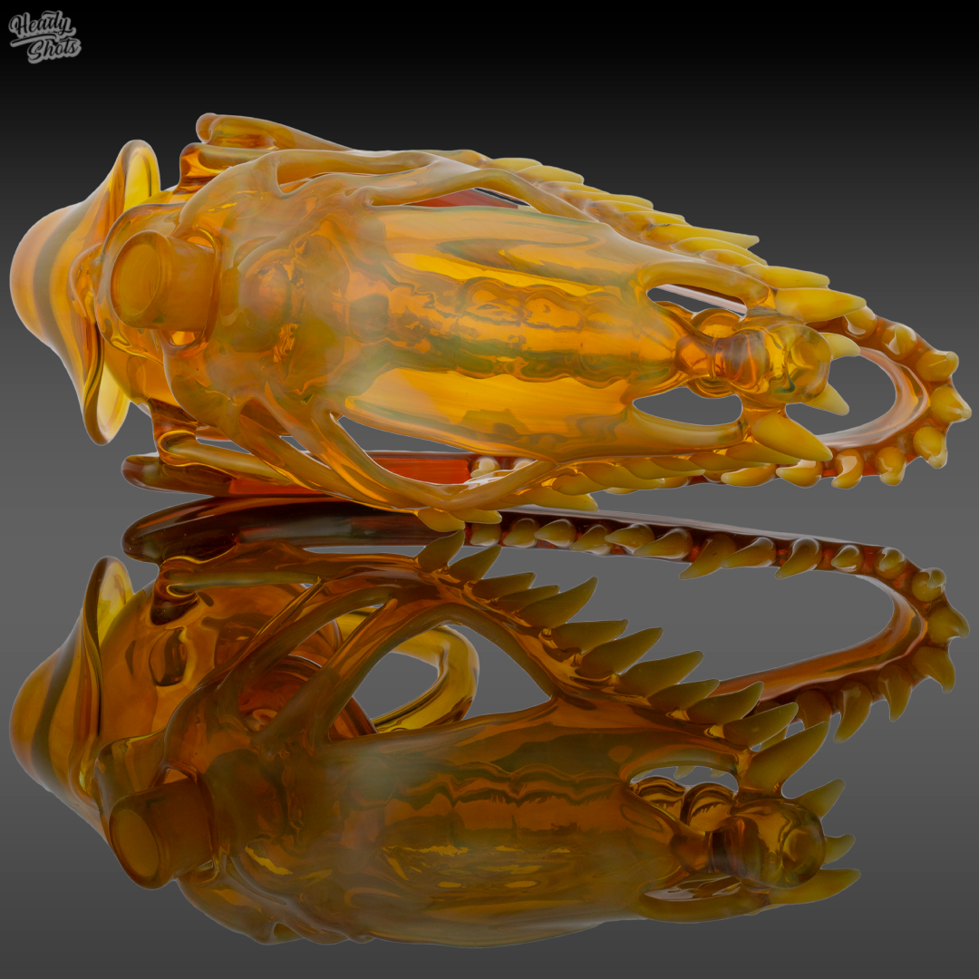  Buck Glass NS Yellow Allosaurus Skull Dab Rig in a lifestyle setting, combining artistry with premium functionality.