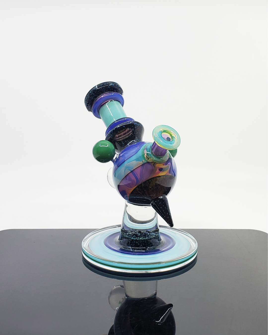 Cajun Glass Two-Tone Crushed Opal Heliosphere, a limited edition 14mm heady glass rig combining eye-catching opal detailing with a clean two-tone finish, a collector's dream offering both artful appearance and excellent function in one standout piece.