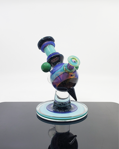 Cajun Glass Two-Tone Crushed Opal Heliosphere, a limited edition 14mm heady glass rig combining eye-catching opal detailing with a clean two-tone finish, a collector's dream offering both artful appearance and excellent function in one standout piece.