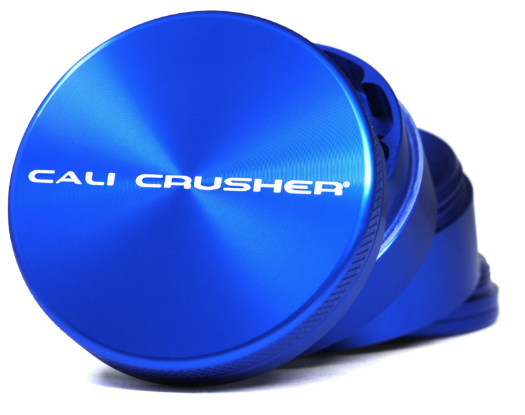 Cali Crusher 2.5" 4 Piece Grinder opened to display its sharp diamond cut blades and spacious grinding chamber.