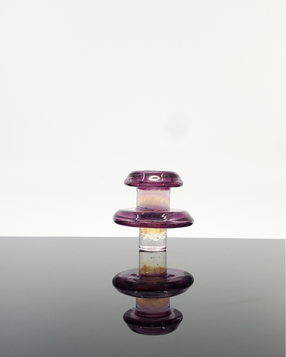 Demonstrating the Campfire Quartz Two-Tone UFO Tower Cap in use, optimizing dabbing efficiency with vibrant color options.