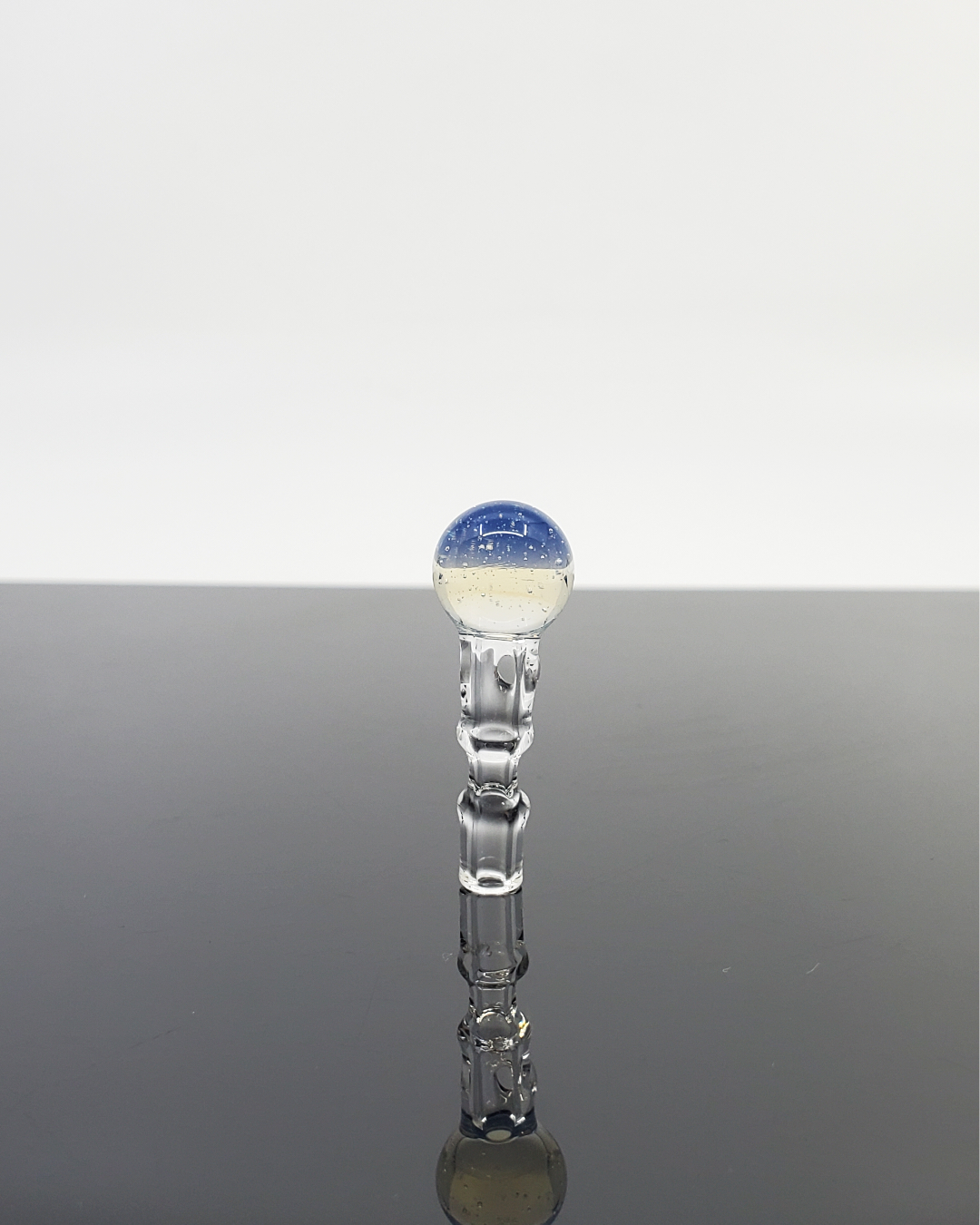 Close-up of the colorful bottom on the Captain Tokez 3DXL Joystick Cap, showing off the vibrant design.