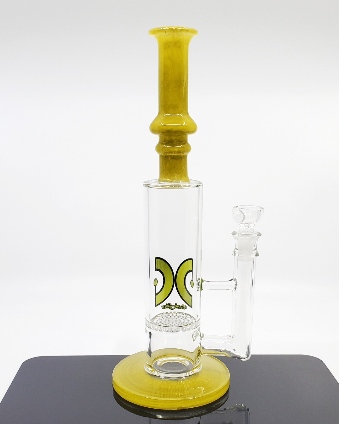  Side view of the Dank Glass 12” Honeycomb Straight Tube showcasing its honeycomb perc and sturdy construction for enhanced filtration and smooth draws.