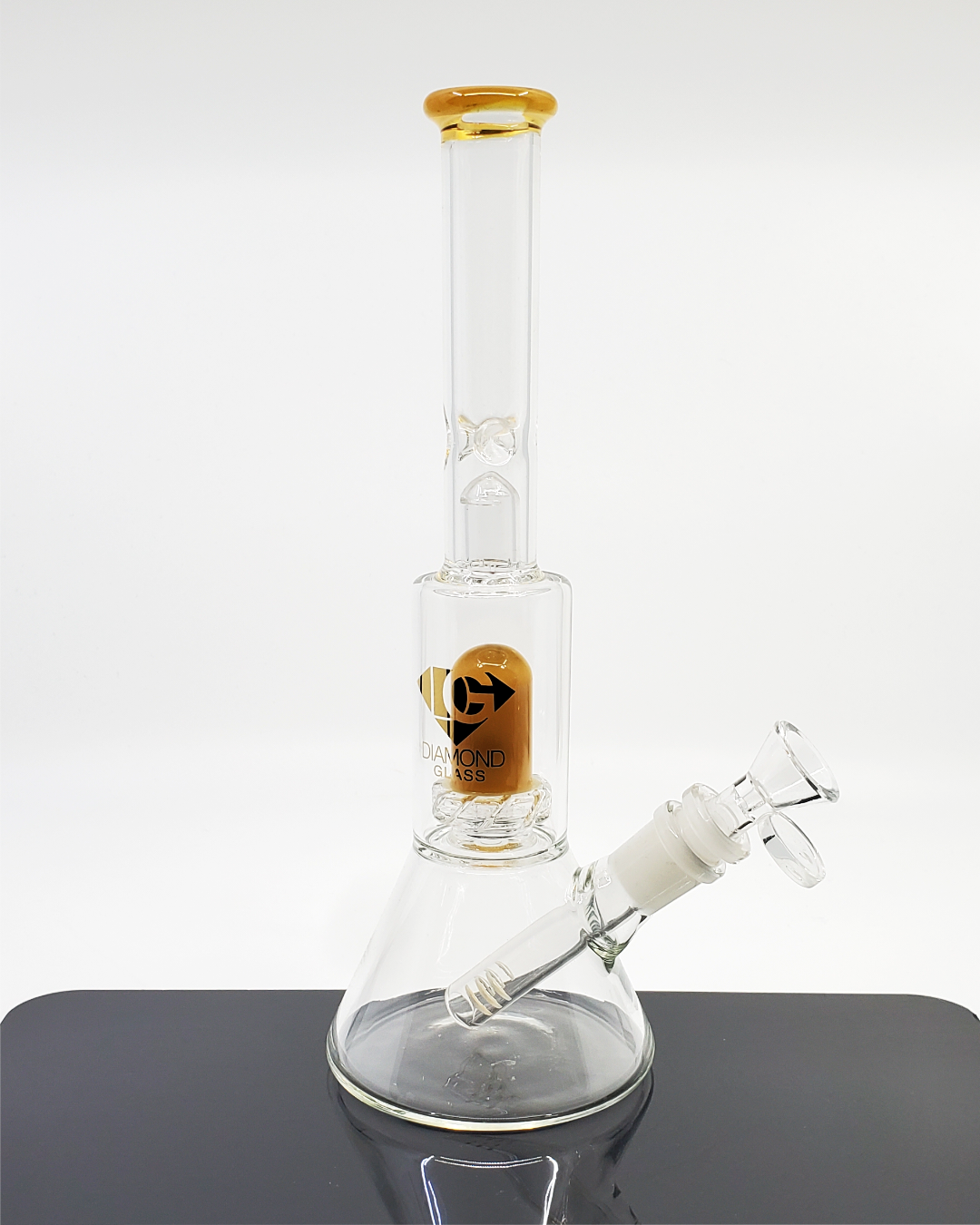  Diamond Glass 10.5” Showerhead Beaker featuring a 7-hole showerhead perc, ice catcher, and 14mm joint for smooth, clean hits and enhanced filtration.

