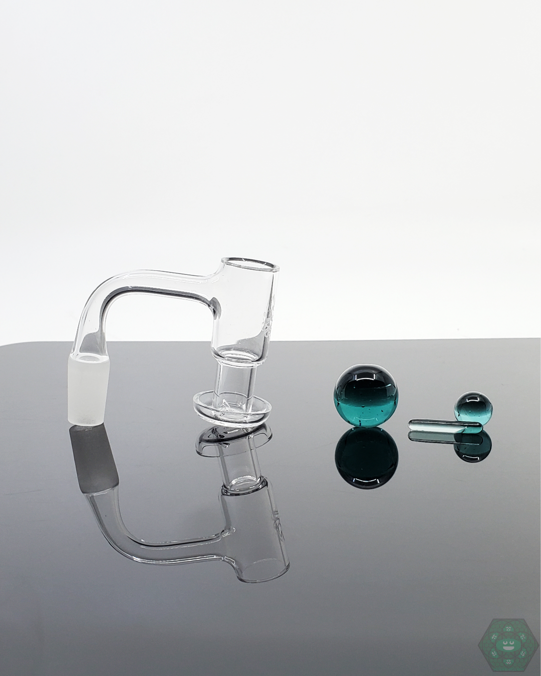 Angled view of Doq Glass Premium Slurper Set, showcasing its precision quartz components.
