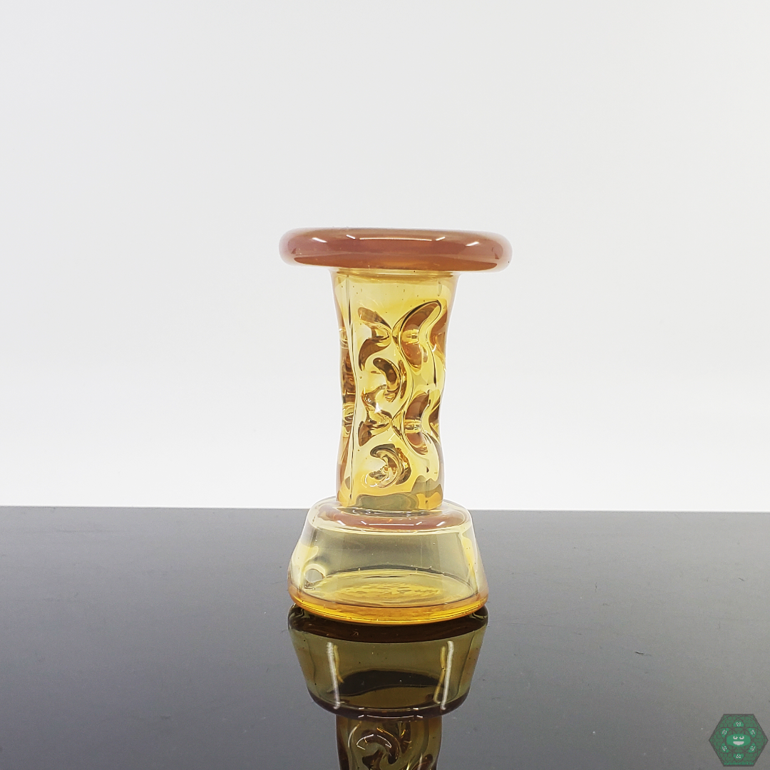 Durin Glass Cooling Tower Puffco Attachment in a lifestyle setting, showcasing its stylish and functional design.