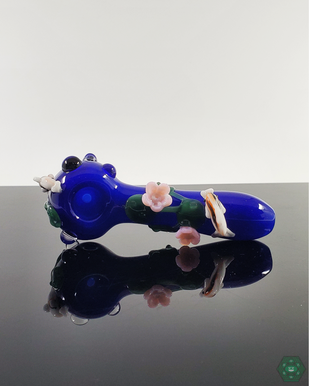  Empire Glassworks Koi Pond Spoon Pipe featuring intricate koi fish and lily pad details for a nature-inspired design.
